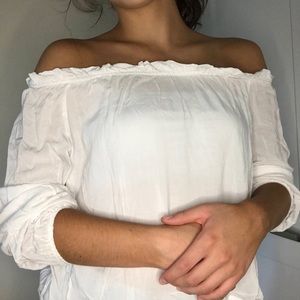 white long sleeved off the shoulder blouse!